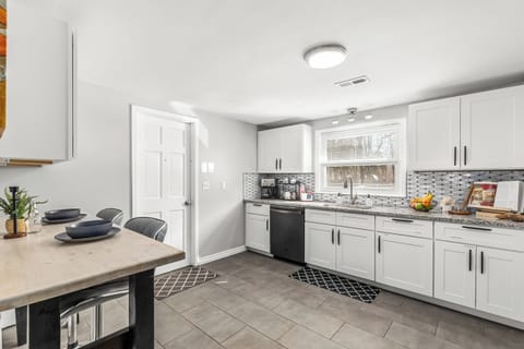 The fully equipped kitchen with granite countertops is ready for your MasterChef skills.