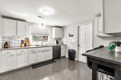 Serve your delicious meals easily at the lovely kitchen dining area.