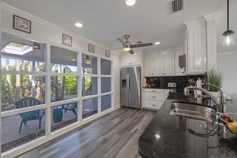 Plenty of sunlight into fully stocked kitchen.