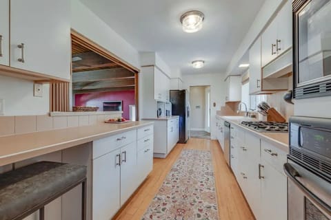 Galley kitchen with everything you need! and beautiful view out the window.
