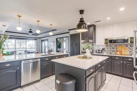 Custom kitchen — black cabinetry, patterned tile, and chef-ready layout.