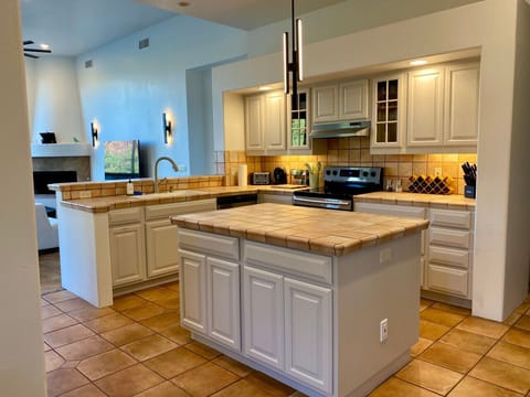 Fully stocked chef’s kitchen with modern appliances and space to create gourmet meals