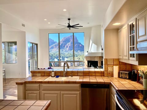 Prepare a feast or whip up margaritas while staying connected to the central gathering space and nature beyond