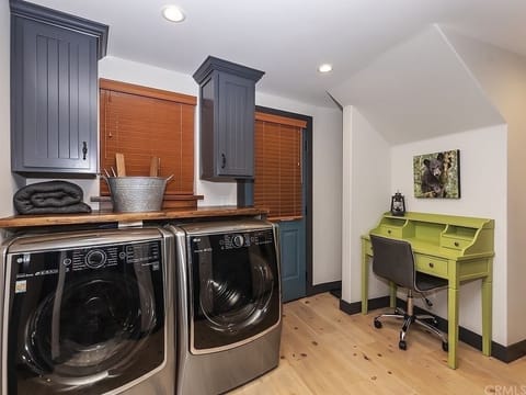 Washer/dryer and work area. Door leads out to the hot tub.