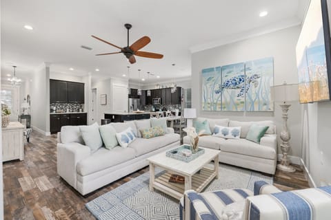 Open concept living, dining, and kitchen for gathering