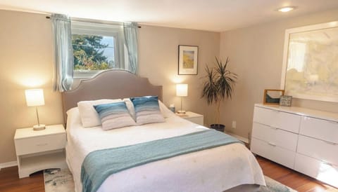 Cozy bedroom with warm lighting.