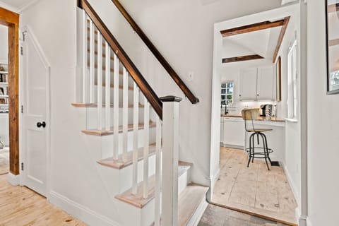 Stairs to access the second floor with 2 bedrooms and full bathroom