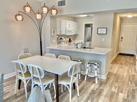 Dining room table with seating for 6 and breakfast bar with seating for 4 more!