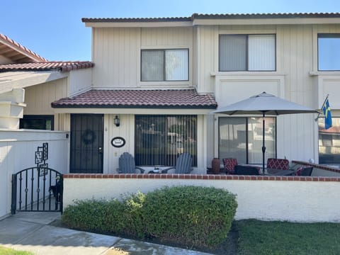 Front of the townhouse with patio for outdoor dining and relaxing