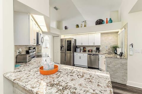 You can’t miss with this fully equipped kitchen. Gleaming granite countertops, a French door refrigerator, stainless steel 4-burner stove with dual oven, dishwasher, coffee maker, and toaster await. It’s perfect for all your culinary needs.