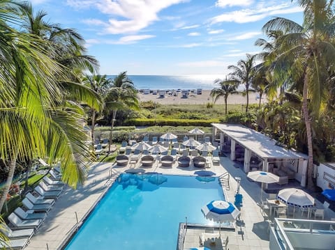 Soak up ocean breezes beside the sparkling resort pool.