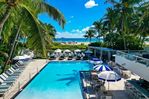 Dive into turquoise calm with loungers and ocean breezes.