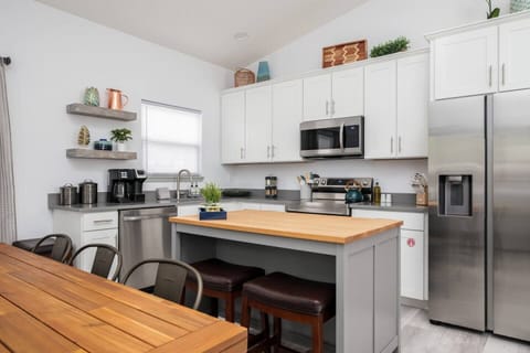 The open kitchen and dining area is perfect for preparing a quick breakfast before a day of exploring and is equipped with everything you need for more involved meals as well