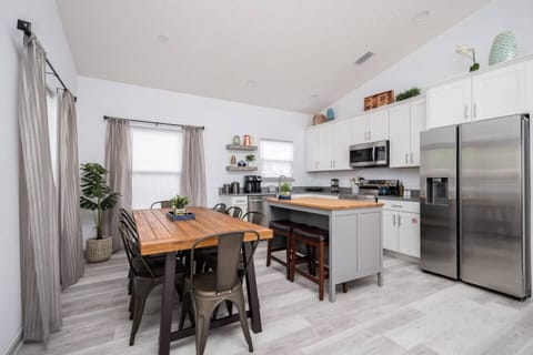 The dining table is an extension of the kitchen and comfortably seats 8 guests