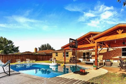 Private backyard haven with ample sitting and entertainment possibilities.