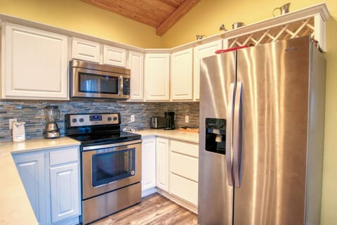 Stainless steel appliances, ample storage and spacious countertops will bring out your inner chef as you prepare meals in this luxurious kitchen.