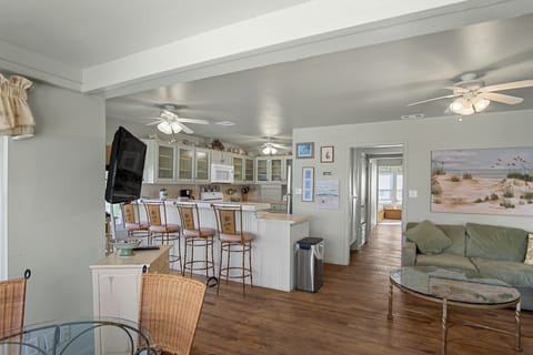 Stay Connected - Enjoy a family meal or a snack while chatting with the cook! The kitchen table is conveniently located next to all of the action.