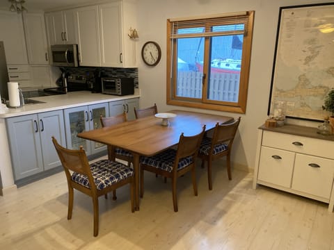 Dining area with kitchen on the left