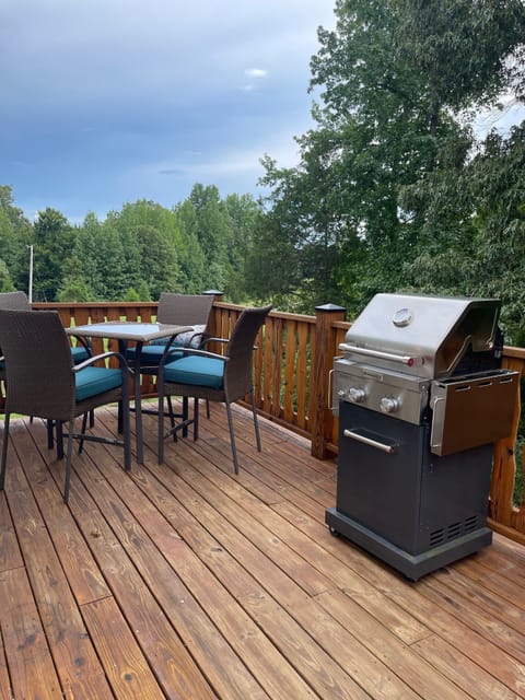 Deck with outdoor seating and gas grill