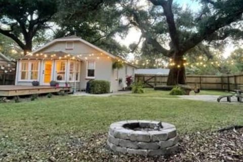 backyard retreat awaits with two fireside areas and two outdoor dining spaces