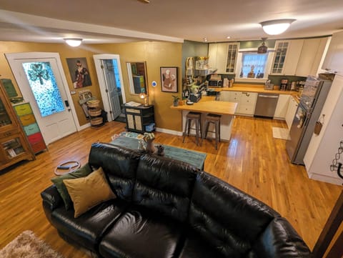 View of Kitchen and Primary Bathroom / Laundry entry on left