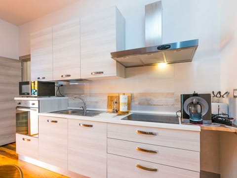 Cabinetry, Countertop, Property, Kitchen Stove, Kitchen Appliance, Kitchen, Drawer, Wood, Building, Interior Design