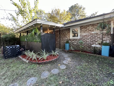 Front patio/ main entrance from Private parking driveway.