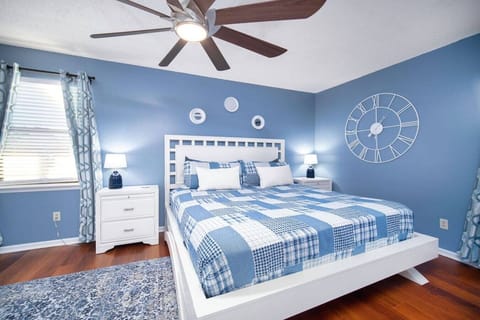 Cozy and serene bedroom featuring calming blue tones and modern décor, perfect for a restful night`s sleep!