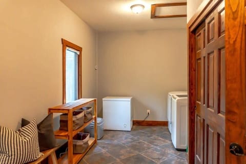 Just off of the kitchen area, you will find a mud room with a washer and dryer for any laundry needs and access to the garage.