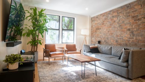 The living room overlooks the street. The sofa opens into a queen bed. 