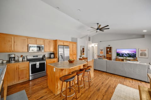 Kitchen room with kitchen island opens to the spacious living  room