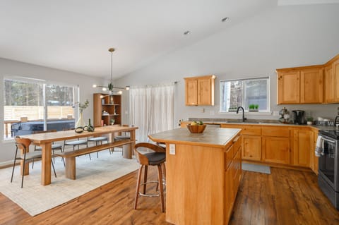 Dining room opens to the spacious kitchen with kitchen island. 