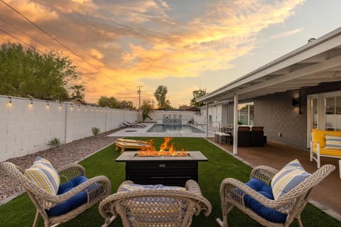 WOW! Have a drink overlooking the pool, by the fire pit.