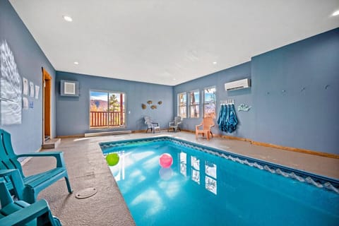 The heated indoor pool is located on the lower level of the cabin. A code to the lock on the door will be provided. The sliding door opens to the lower deck and hot tub outside.