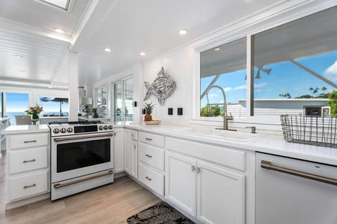 Fully-equipped kitchen on the main house's first floor provides a convenient and functional cooking space.