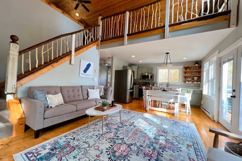 Enjoy the open concept living area with vaulted ceilings and big windows