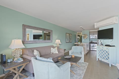 View from slider in living area into kitchen and the exit into entry hall.