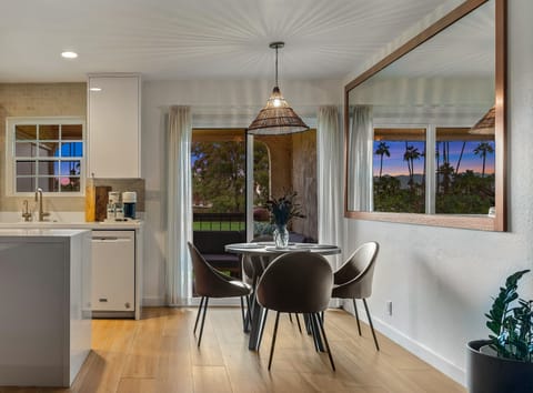 Dining with large mirror that amplifies views