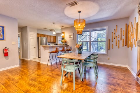 The dining table with seating for six and the bar provides another three seats.