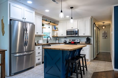 Fully stocked kitchen with Keurig, blender, toaster, and more