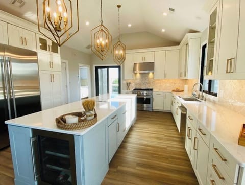  Beverage cooler & microwave in island. 48 inch refrigerator, dishwasher, etc.