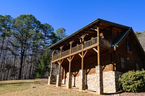 Front of cabin with raised porch deck.