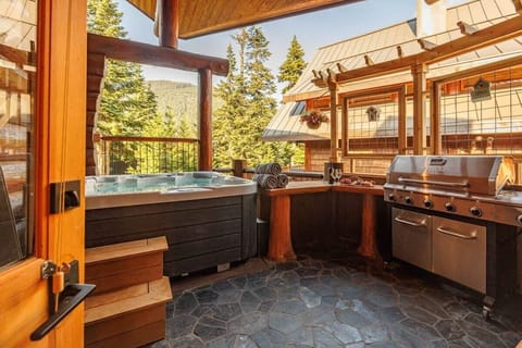 Inviting mountain-view deck with 6 person hot tub and new grill amenities.