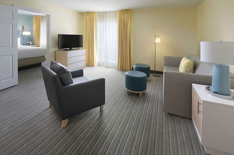 Spread out in a bright suite with cozy seating.