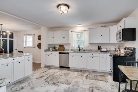 Large fully stocked kitchen with island.
