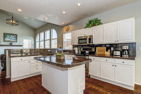Kitchen with Stainless Appliances and lots of Room for Entertaining & Cooking.