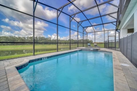 - Screened private pool with calm water views and sunny deck for daily swims
- Spacious outdoor pool area ideal for family stays group trips and breaks
- Quiet backyard setting near parks dining shopping and top attractions  
