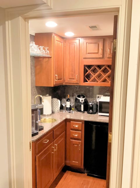 Kitchen with refrigerator, microwave, air fryer, toaster, & Keurig with pods