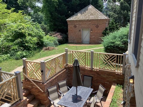 Brick patio with mid-1800s brick smokehouse that is on the property.