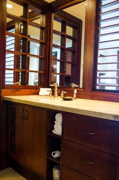 Unwind with warm wood finishes and a spa-like vanity.